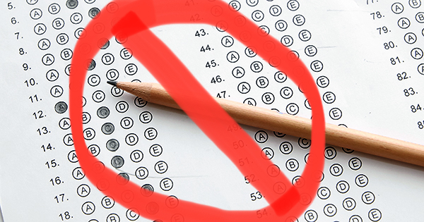 Standardized test form with answers bubbled in and a pencil, focus on anser sheet